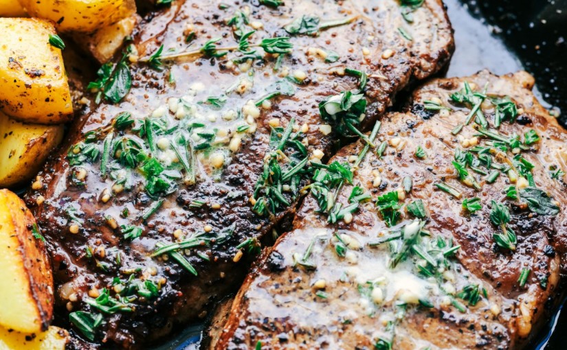 SKILLET GARLIC BUTTER HERB STEAK AND POTATOES
